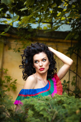 Woman wearing flowers dress in hot summer city