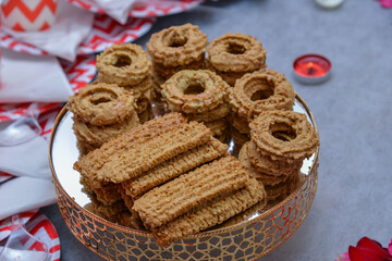 Festive traditional Tagine with festive Moroccan Kaak, anise cookies, close up