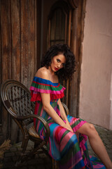 Fototapeta premium Woman wearing flowers dress in hot summer city