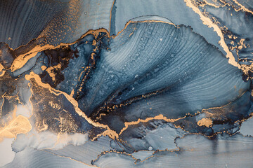 Luxury abstract fluid art painting in alcohol ink technique, mixture of dark blue, gray and gold paints. Imitation of marble stone cut, glowing golden veins. Tender and dreamy design. - 444963900