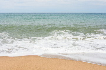 Fototapeta na wymiar waves on the beach minimal background