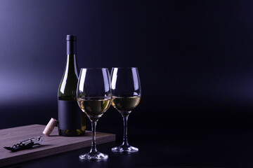 wine glass with bottle and black background