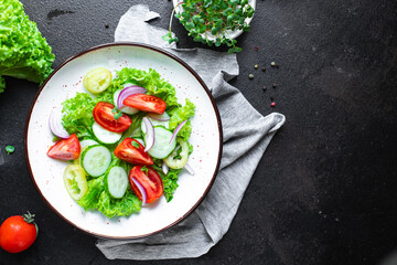 fresh salad organic vegetables tomato, cucumber, pepper, onion, lettuce meal snack copy space food background rustic. top view keto or paleo diet veggie vegan or vegetarian food