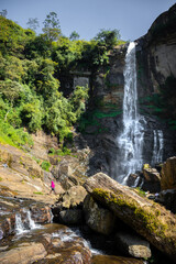 Beautiful Ramboda Falls landscape photograph. It's also going by the name of Puna Ella. A powerful stream of water falling down through the high rocky mountain,