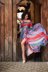 Naklejka premium Woman wearing flowers dress in hot summer city