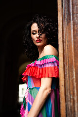 Sensual summer portrait of fashion woman in summer dress and flowers in the city