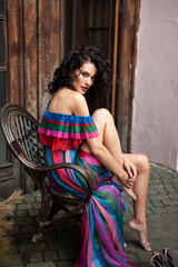 Fototapeta premium Sensual summer portrait of fashion woman in summer dress and flowers in the city