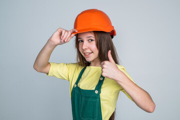 thumb up. female builder in hard hat. building and construction. child architect worker.
