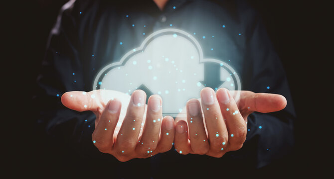 Cloud computing technology internet storage network concept. Man hands holding virtual icon cloud - Powered by Adobe