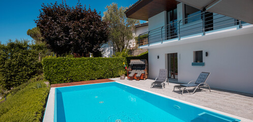 Modern two-story house with large pool overlooking the mountains. Nobody inside