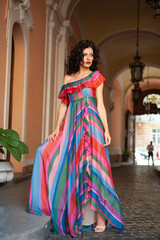 Fototapeta premium High fashion model in elegant clothing woman outdoor. Floral dress. Sexy tanned woman. 