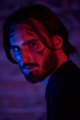 agent with scars on his face