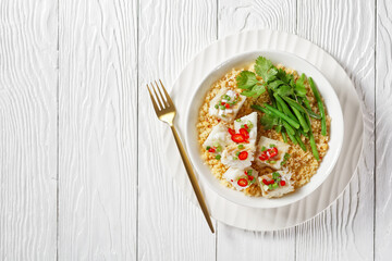 cod with bulgur, steamed green beans, top view