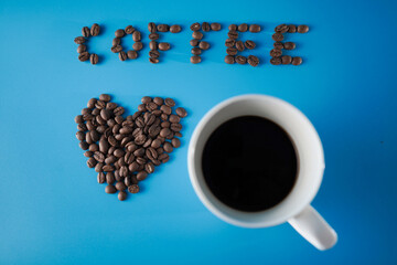 Roasted coffee bean. Coffee is good for health. One cup of coffee per day can make us clam until night. Blue background.