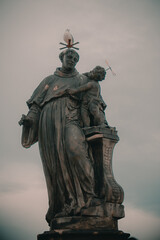 Fototapeta na wymiar PRAGUE, CZECH REPUBLIC - Statue on the Charles Bridge, Prague, Czech Republic.