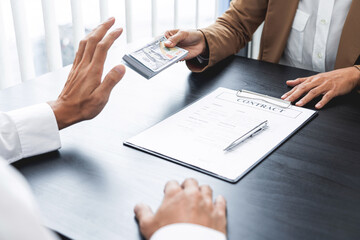 Businessman partner hand gesture rejecting refusing money, anticorruption concept.