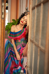 Attractive sensual woman wearing summer dress in the old city