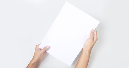 Hands holding paper blank for letter paper