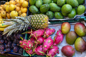 Fresh tropical fruits. Selling crops on the market.