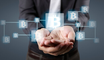 Hands showing bitcoin as virtual money on digital
