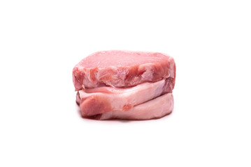Raw pork pieces isolated on a white background.