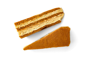 Slice of honey cake isolated on white background.