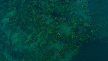 Fototapeta na wymiar Drone view of canoe on amazing lake