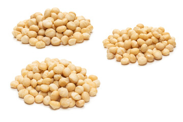 Macadamia nuts isolated on white background.