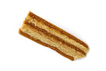 Slice of honey cake isolated on white background.