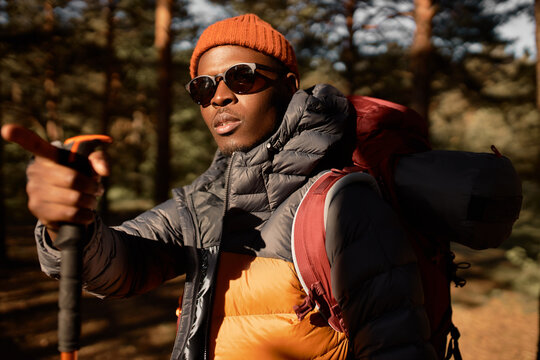 Aframerican Man Search For Right Direction In Forest, Point With Finger On Right Path. Guy Ready For Adventure, Enthusiastic Mood, Exploring New Places. Travelling And Summer Tourism Concept