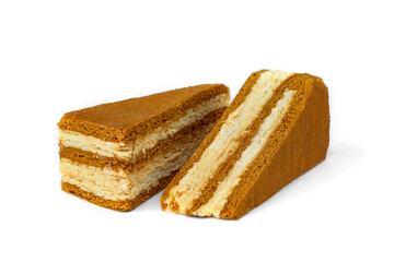 Slice of honey cake isolated on white background.