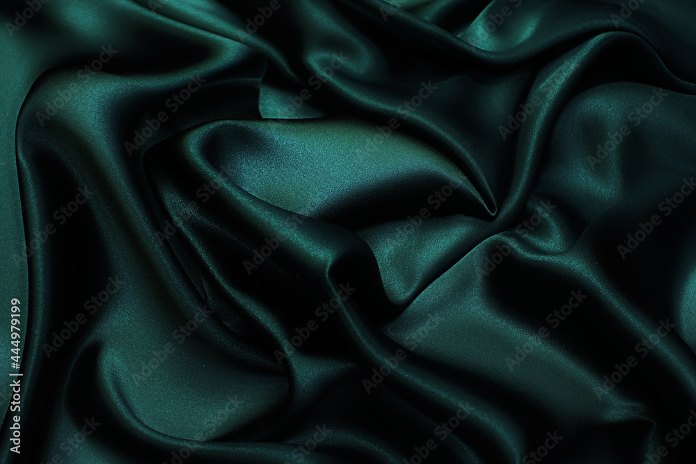 Wall mural silk fabric, satin. the color is dark green. texture, background, pattern.