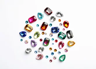 Fototapete Different beautiful gemstones on white background, top view © New Africa