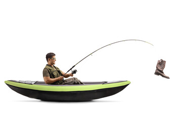 Fisherman in a kayak and a fishing rod with a boot on the hook