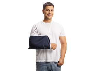 Young man with a broken arm wearing an arm splint and smiling - obrazy, fototapety, plakaty
