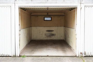 Empty garage with an open gate