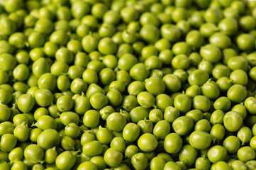 Fototapeta na wymiar green peeled peas, top-side view, close-up