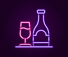Glowing neon line Wine bottle with glass icon isolated on black background. Colorful outline concept. Vector