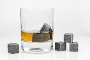 whiskey cooling stone cubes and glass with whiskey