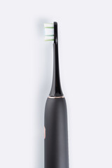 Smart electric toothbrush. Modern technology for health. Healthy teeth. Dentistry. Concept of professional oral care and healthy teeth by using ultrasonic smart toothbrush. 