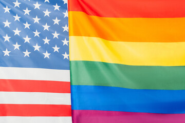 close up of american and lgbt flags, equality rights concept