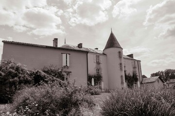 19th century Poitou Manor house at La Belle Flower Garden in Magne France in black and white