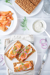 Picked salmon cream cheese rye bread in a plate