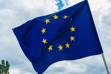 low angle view of european union flag with yellow stars against sky