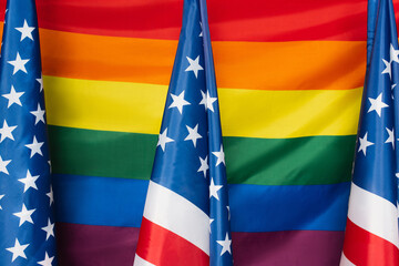 american flags against lgbt colorful background. usa
