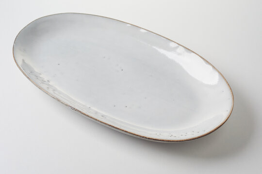 Long empty oval platter or plate in generic white pottery
