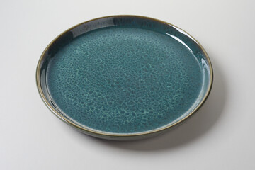 Decorative mottled blue clean empty round pottery plate