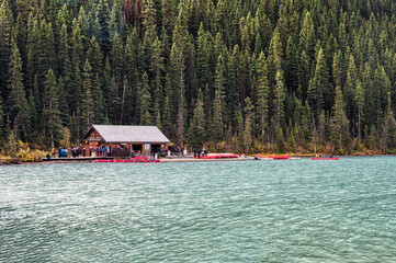 Tourists waiting to rent a canoe from tourist service cottage in Lake Louise at Banff national park