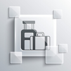 Grey Suitcase for travel icon isolated on grey background. Traveling baggage sign. Travel luggage icon. Square glass panels. Vector