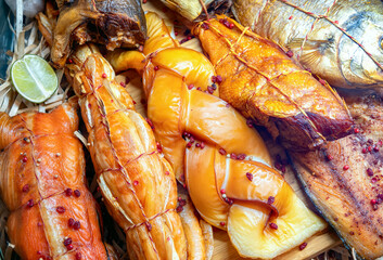 Smoked fish at the fish market. Various smoked fish in seafood market.